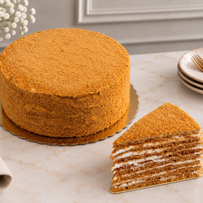 dän honey cake (medovik) — whole 8-inch, thin honey layers with cream, coated in honey crumb