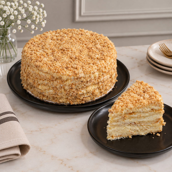 dän Napoleon cake — whole 8-inch, crisp butter-pastry layers with light cream and pastry crumb